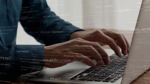 Computer programmer uses capable laptop computer to develop programming code Stock Footage 172147972
