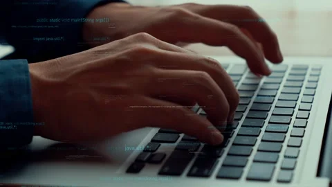 Computer programmer uses capable laptop computer to develop programming code Stock Footage 172367231