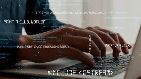 Computer programmer uses capable laptop computer to develop programming code Stock Footage 173359151