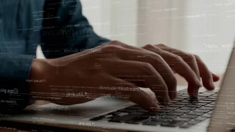Computer programmer uses capable laptop computer to develop programming code Stock Footage 181326671