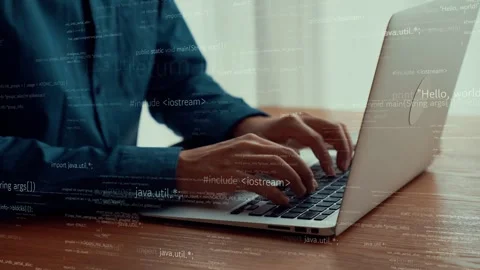 Computer programmer uses capable laptop computer to develop programming code Stock Footage 295042674