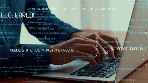 Computer programmer uses capable laptop computer to develop programming code Stockfoto's