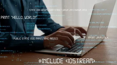 Computer programmer uses capable laptop computer to develop programming code Stock Photos