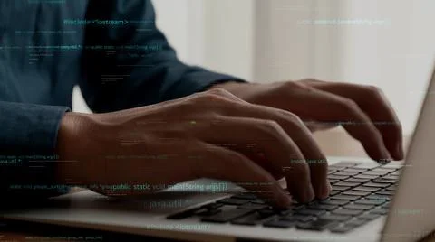 Computer programmer uses capable laptop computer to develop programming code Stock Photos