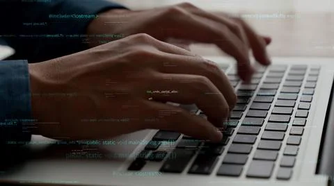 Computer programmer uses capable laptop computer to develop programming code Stock Photos