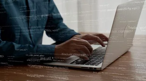 Computer programmer uses capable laptop computer to develop programming code Stock Photos