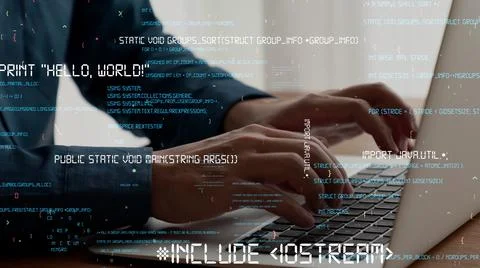 Computer programmer uses capable laptop computer to develop programming code Stock-Fotos