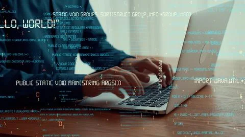 Computer programmer uses capable laptop computer to develop programming code Stock Photos