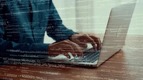 Computer programmer uses capable laptop computer to develop programming code Stock Photos