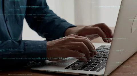 Computer programmer uses capable laptop computer to develop programming code Stock Photos