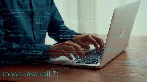 Computer programmer uses capable laptop computer to develop programming code Stock Photos