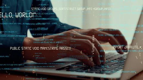 Computer programmer uses capable laptop computer to develop programming code Foto stock