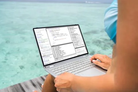 Computer Programmer Using Development Software On Laptop Stockfoto's