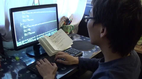 Computer programmer watching the running program log and trying to fix the bugs Stock Footage 42785203