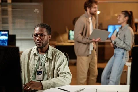 Computer programmer wearing glasses Stock Photos
