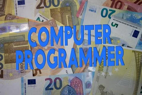 Computer Programmer word with money. Paper currency background with differe.. Stock-Fotos