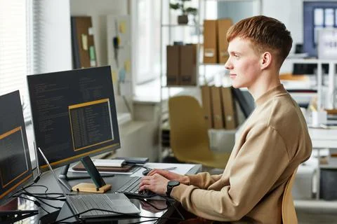 Computer programmer working on computer Foto stock