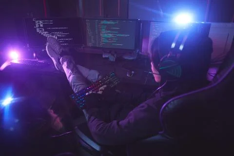 Computer Programmer Working in Dark Stock Photos