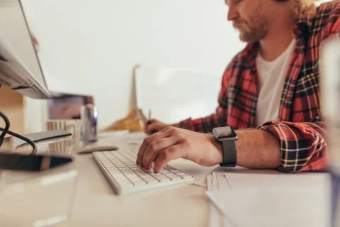 Computer programmer working at the desk Stock Photos