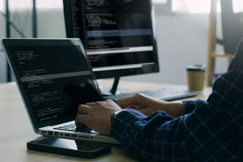 Computer programmer working on new software program.Coder recruited for sol.. Foto stock