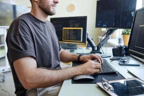 Computer Programmer at Workplace Side View Stock Photos