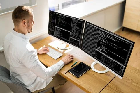 Computer Programmer Writing Program Code On Computer Photos