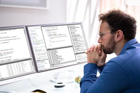 Computer Programmer Writing Program Code On Computer Stock Photos