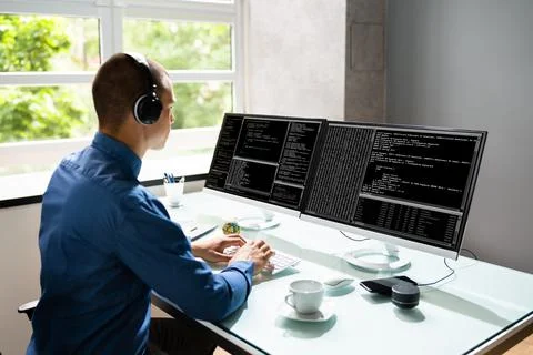Computer Programmer Writing Program Code On Computer Stock Photos