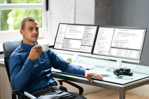 Computer Programmer Writing Program Code On Computer Foto stock