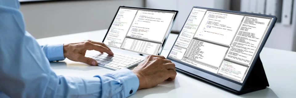 Computer Programmer Writing Program Code On Computer Photos