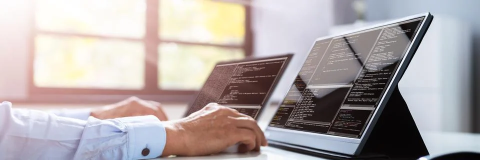 Computer Programmer Writing Program Code On Computer 写真素材