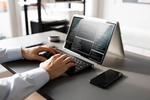 Computer Programmer Writing Program Code On Computer Foto stock