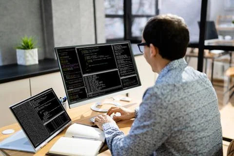 Computer Programmer Writing Program Code On Computer Stock Photos
