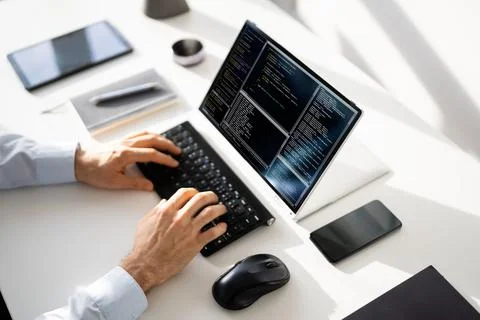 Computer Programmer Writing Program Code On Computer Photos