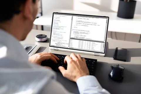 Computer Programmer Writing Program Code On Computer Stock Photos