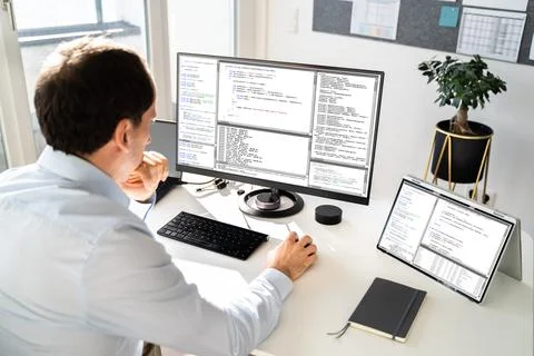 Computer Programmer Writing Program Code On Computer Stock Photos