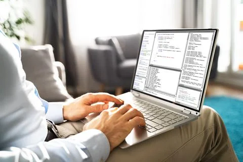 Computer Programmer Writing Program Code On Computer Stock Photos