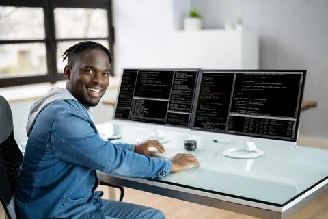 Computer Programmer Writing Program Code On Computer Stock Photos