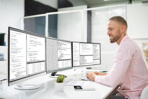 Computer Programmer Writing Program Code On Computer Stock Photos