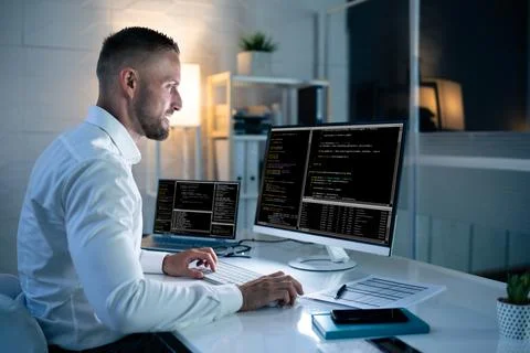 Computer Programmer Writing Program Code On Computer Stock-Fotos