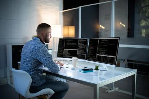 Computer Programmer Writing Program Code On Computer Stock Photos