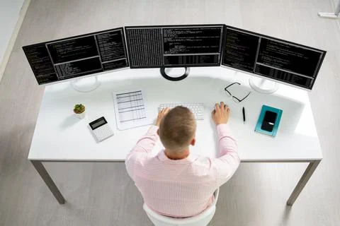 Computer Programmer Writing Program Code On Computer Stock Photos