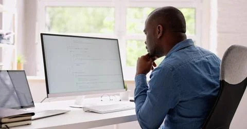 Computer Programmer Writing Program Code On Computer Photos