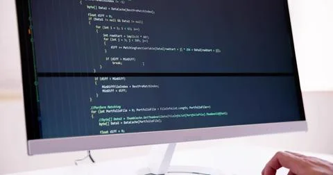 Computer Programmer Writing Program Code On Computer Stock-Fotos