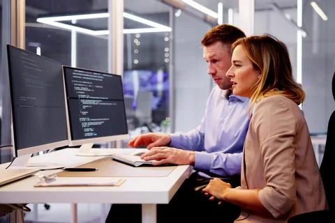 Computer Programmer Writing Program Code On Computer Photos