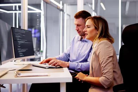 Computer Programmer Writing Program Code On Computer Stock Photos