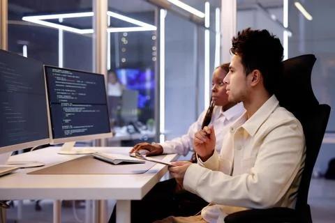 Computer Programmer Writing Program Code On Computer 库存照片