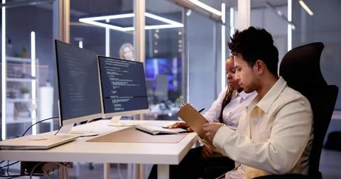 Computer Programmer Writing Program Code On Computer Stock Photos