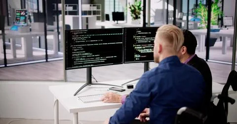 Computer Programmer Writing Program Code On Computer 写真素材