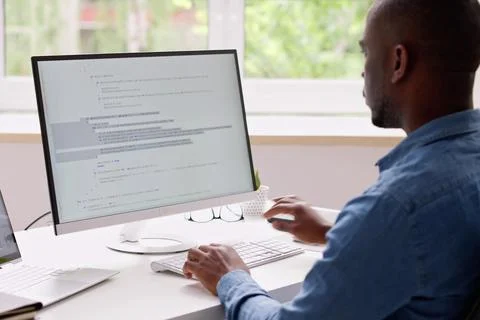 Computer Programmer Writing Program Code On Computer Photos